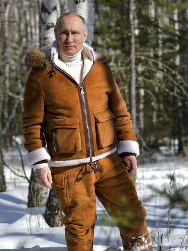 In this photo made available on Sunday, March 21, 2021, Russian President Vladimir Putin poses for a photo in a taiga forest in Russia's Siberian region. Putin and Russia Defense Minister Sergei Shoigu are spending the weekend in Siberia said Kremlin spokesman Dmitry Peskov. (Alexei Druzhinin, Sputnik, Kremlin Pool Photo via AP)