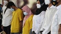 YJ dan S ditangkap polisi pada Minggu (21/3).