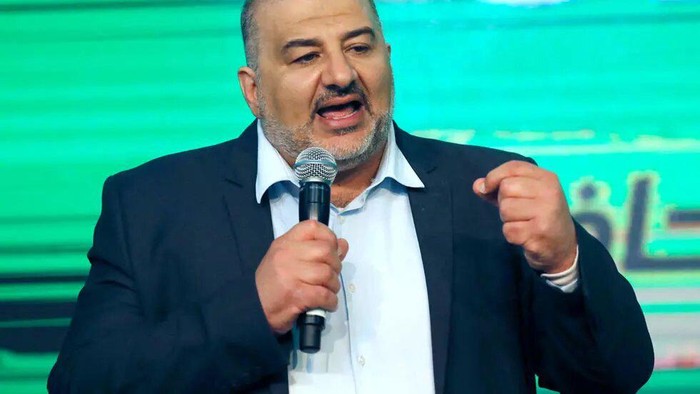 Mansour Abbas, head of the conservative Islamic party Raam, addresses supporters at his campaign headquarters in the northern Israeli city of Tamra on March 23, 2021. AFP - AHMAD GHARABLI