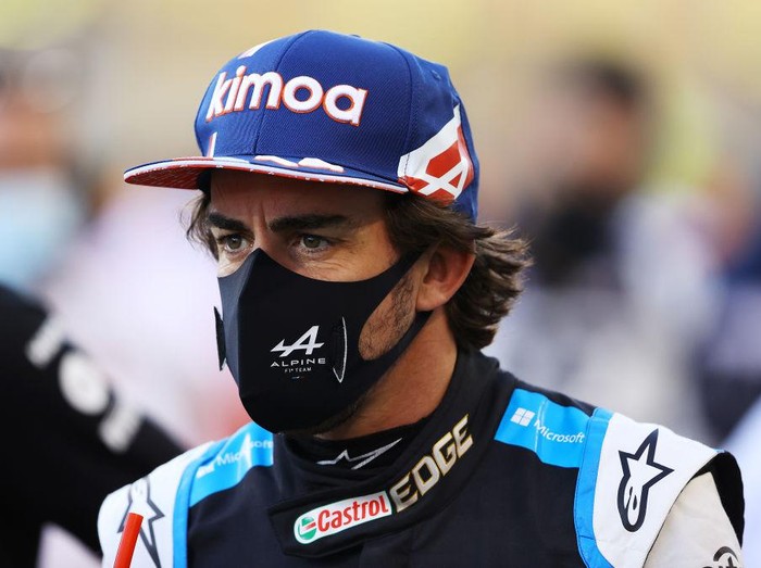 BAHRAIN, BAHRAIN - MARCH 28: Fernando Alonso of Spain and Alpine F1 Team looks on from the grid prior to the F1 Grand Prix of Bahrain at Bahrain International Circuit on March 28, 2021 in Bahrain, Bahrain. (Photo by Bryn Lennon/Getty Images)