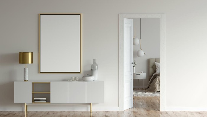 3d illustration. Mock up poster and a cabinet with lamp and decor in the beige interior with open door to the modern bedroom.