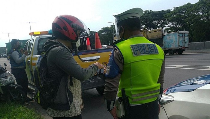 motor masuk tol