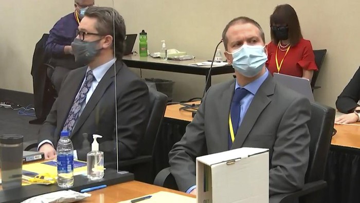 In this image from video, defense attorney Eric Nelson, left, and former Minneapolis police officer Derek Chauvin listen as Hennepin County Judge Peter Cahill presides over pre-trial motions prior to opening statements, Monday March 29, 2021, in the trial of Chauvin, in the May 25, 2020, death of George Floyd at the Hennepin County Courthouse in Minneapolis, Minn. (Court TV via AP, Pool)