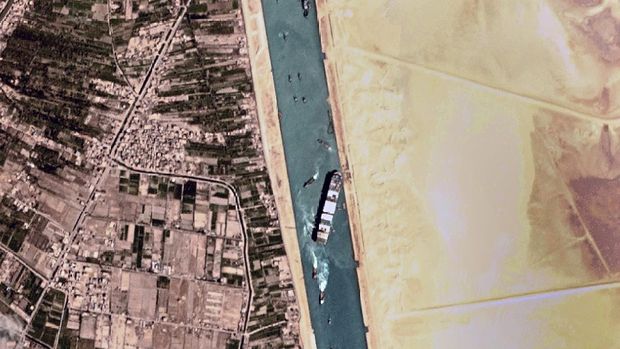 This satellite photo from Planet Labs Inc. shows the Ever Given cargo ship stuck in Egypt's Suez Canal Monday, March 29, 2021. Engineers on Monday 