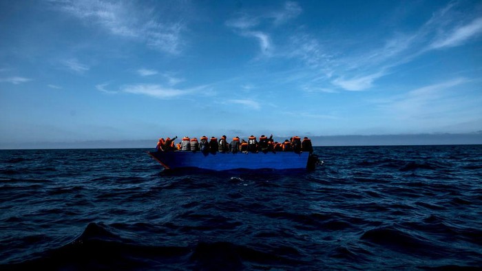 AT SEA - MARCH 29: Two lifeguards from the Spanish NGO Open Arms approach a wooden boat to rescue 84 migrants of different nationalities on March 29, 2021 in At Sea, Unspecified. The Spanish NGO Open Arms rescued passengers in two wooden boats, with 84 and 97 people respectively. The Open Arms vessel now has a total of 219 migrants, rescued in the Malta SAR (Search and Rescue) zone. (Photo by Carlos Gil/Getty Images)