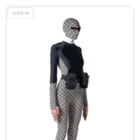 Tas botol air minum dari Marine Serre hadir dengan model tas pinggang bergaya militer. Cocok buat kamu yang suka gaya utilitarian. (Foto: Dok. Marine Serre)