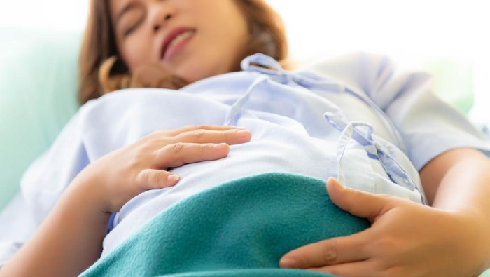 1091665202 Pregnant woman gets painful or hurt of her belly. Mother gets suffered because mother nearly gives birth her baby or children. It is the first time of her life. Its sign of preterm infant. suffer face