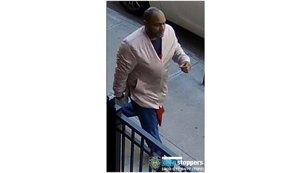 This image taken from surveillance video provided by the New York City Police Department shows a person of interest in connection with an assault of an Asian American woman, Monday, March 29, 2021, in New York. The NYPD is asking for the public's assistance in identifying the man. (Courtesy of New York Police Department via AP)