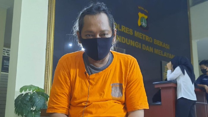 Herman alias Hermawan alias Ustaz Gondrong tersangka penipuan penggandaan uang.