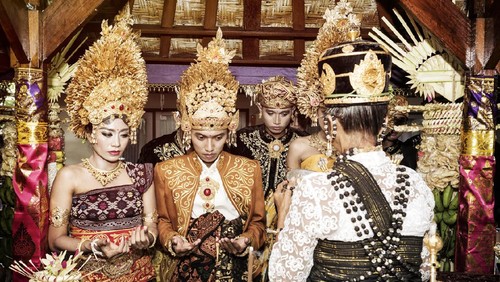 Bali, Indonesia - February 11. Woman enacting wedding scene in preparation for religious ceremony on February 11, 2012 in Bali, Indonesia. Most Balinese get married in their early 20s.
