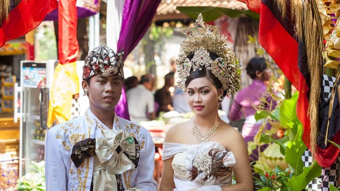 Bali, Indonesia - February 11. Woman enacting wedding scene in preparation for religious ceremony on February 11, 2012 in Bali, Indonesia. Most Balinese get married in their early 20s.