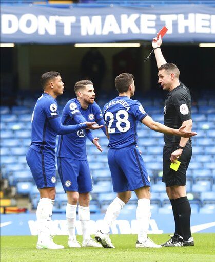 Chelsea's Thiago Silva is shown a red card by referee David Coote during the English Premier League soccer match between Chelsea and West Bromwich Albion at Stamford Bridge stadium in London, England, Saturday, April 3, 2021.(Clive Rose/Pool via AP)