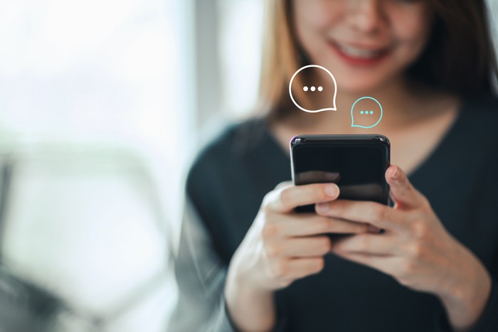 Womens hand typing on mobile smartphone, Live Chat Chatting on application Communication Digital Web and social network Concept. Work from home.