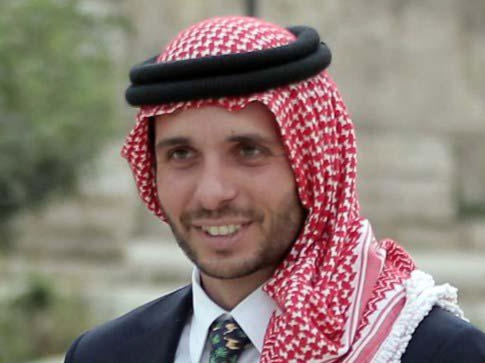 Jordanian Prince Hamzah bin al-Hussein, president of the Royal Aero Sports Club of Jordan, carries a parachute during a media event to announce the launch of 