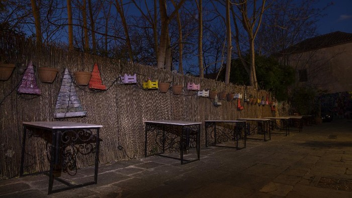 Chairs are stored outside a shuttered coffee shop in Plaka, district of Athens, on Monday, March 29, 2021. Restaurants, bars and cafes, whose nature it is to gather groups of people closely together, have remained shut since November when the Greek government imposed a second lockdown to curb the spread of COVID-19 infections. (AP Photo/Petros Giannakouris)