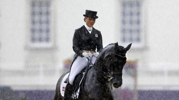 Anna Kasprzak, of Denmark, and her horse Donnperignon, compete in the equestrian dressage at the 2012 Summer Olympics, Thursday, Aug. 2, 2012, in London. (AP Photo/David Goldman)