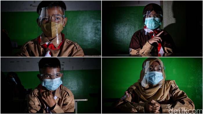 Guru memberikan pelajaran kepada murid saat uji coba belajar tatap muka di kawasan SDN 11 Pademangan Barat, Jakarta Utara, Rabu (7/4). SDN Pademangan Barat 11 memulai uji coba belajar tatap muka bagi siswa kelas V di tengah pandem COVID-19. Protokol kesehatan menjadi hal utama baik bagi siswa maupun tenaga pendidik.