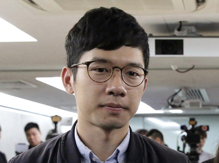 FILE - In this Jan. 27, 2018, file photo, pro-democracy activist Nathan Law, along with Agnes Chow and Joshua Wong, attends a press conference in Hong Kong. Prominent Hong Kong democracy activist Nathan Law has left the city for an undisclosed location, he revealed on his Facebook page shortly after testifying at a U.S. congressional hearing about the tough national security law China had imposed on the semi-autonomous territory. In his post late Thursday, July 2, 2020, he said that he decided to take on the responsibility for advocating for Hong Kong internationally and had since left the city. (AP Photo/Kin Cheung, File)