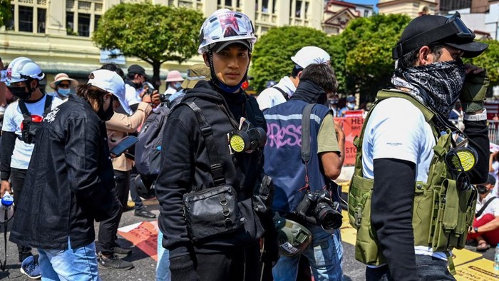 (FILES) In this file photo taken on February 17, 2021, model, actor and singer Paing Takhon (C) attends a demonstration against the military coup in Yangon. - Paing Takhon, who has backed the countrys anti-coup protests was arrested on April 8, reports said, as the junta hunts more than 100 celebrities for supporting the movement. (Photo by STR / AFP)