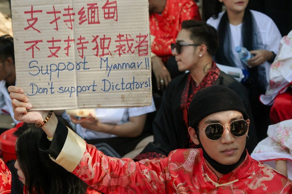 Model, actor and singer Paing Takhon (C) looks on during a demonstration against the military coup in Yangon on February 17, 2021. (Photo by YE AUNG THU / AFP)