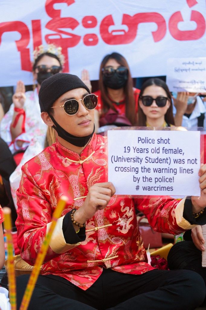 Model, actor and singer Paing Takhon (C) looks on during a demonstration against the military coup in Yangon on February 17, 2021. (Photo by YE AUNG THU / AFP)