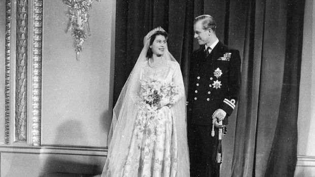 FILE - This Nov. 20, 1947 file photo, the official wedding picture of Princess Elizabeth and her new husband the Duke of Edinburgh, after their return to Buckingham Palace after their marriage in Westminster Abbey. Buckingham Palace officials say Prince Philip, the husband of Queen Elizabeth II, has died, it was announced on Friday, April 9, 2021. He was 99. Philip spent a month in hospital earlier this year before being released on March 16 to return to Windsor Castle. Philip, also known as the Duke of Edinburgh, married Elizabeth in 1947 and was the longest-serving consort in British history. (AP Photo/File)