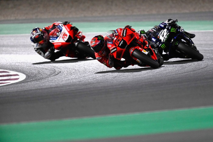 DOHA, QATAR - MARCH 28:  Francesco Bagnaia of Italy and Ducati Lenovo Team leads Maverick Vinales of Spain and Monster Energy Yamaha MotoGP Team and Johann Zarco of France and Pramac Racing during the MotoGP race during the MotoGP of Qatar - Race at Losail Circuit on March 28, 2021 in Doha, Qatar. (Photo by Mirco Lazzari gp/Getty Images)