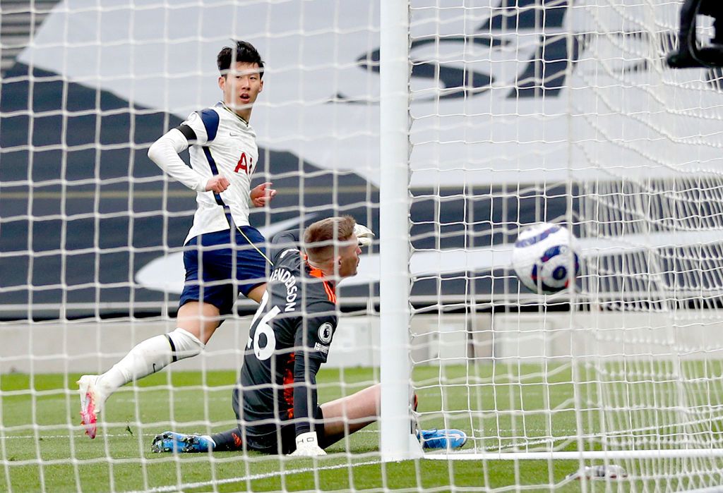 LONDON, ENGLAND - APRIL 11: Son Heung-Min of Tottenham Hotspur celebrates with Sergio Reguilon after scoring their team's first goal during the Premier League match between Tottenham Hotspur and Manchester United at Tottenham Hotspur Stadium on April 11, 2021 in London, England. Sporting stadiums around the UK remain under strict restrictions due to the Coronavirus Pandemic as Government social distancing laws prohibit fans inside venues resulting in games being played behind closed doors. (Photo by Matthew Childs - Pool/Getty Images)