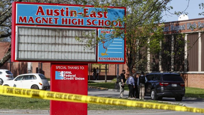 Knoxville police work the scene of a shooting at Austin-East Magnet High School Monday, April 12, 2021, in Knoxville, Tenn. (AP Photo/Wade Payne)