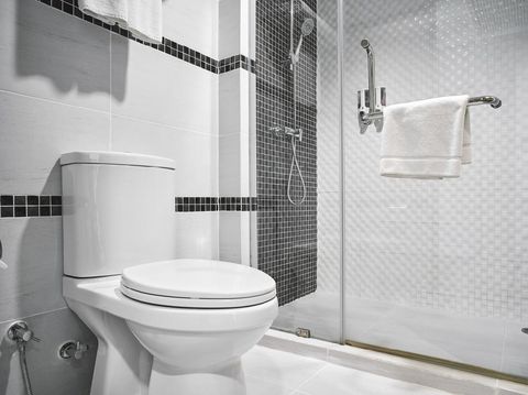 Ilustrasi Kamar Mandi Minimalis Concept of modern decoration design of bathroom with toilet and shower decorating with black and white ceramic for luxury hotel, condominium, residential