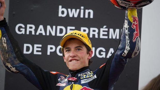 ESTORIL, PORTUGAL - OCTOBER 31:  Marc Marquez of Spain and Red Bull AJo Motorsport celebrates on the podium the victory at the end of the 125 cc race of MotoGP of Portugal on October 31, 2010 in Estoril, Portugal.  (Photo by Mirco Lazzari gp/Getty Images)