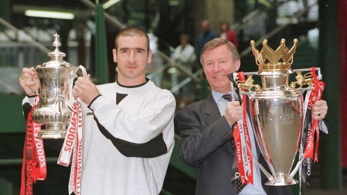 12th May 1996; Manchester United manager Alex Ferguson and Eric Cantona with the FA Cup and Premiership trophy on their arrival at Manchesters Victoria station. Mandatory Credit: Shaun Botterill/ALLSPORT