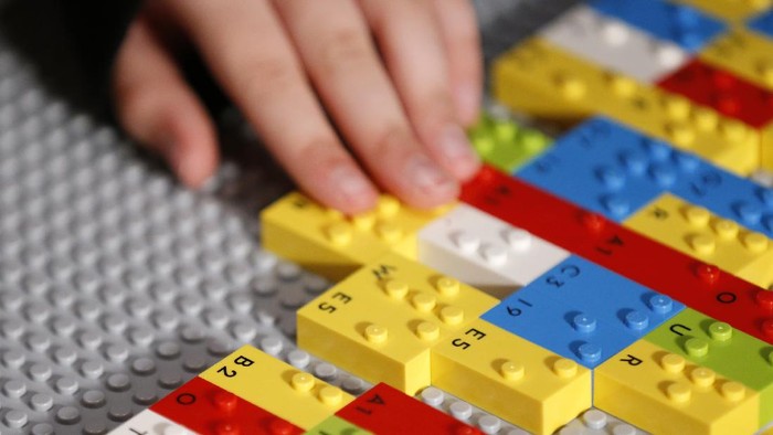 MELBOURNE, AUSTRALIA - APRIL 15: Blind and vision impaired children enjoy Legoland in Chadstone on April 15, 2021 in Melbourne, Australia. LEGOs new range of Braille bricks have raised bumps that have been modified to correspond to a letter or character of the braille alphabet. Each brick also has a printed letter or character to allow children who are blind or have low vision to learn and play alongside sighted classmates, family and educators.  (Photo by Darrian Traynor/Getty Images)