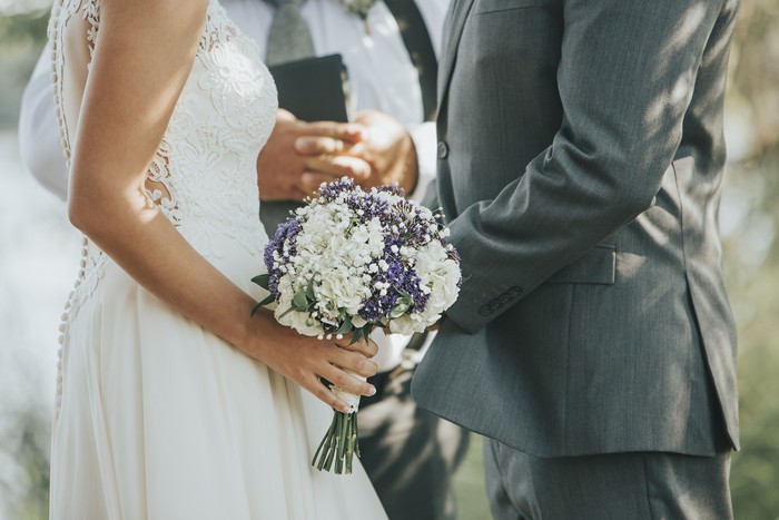 1181587386 Cropped shot of an unrecognizable newlywed couple doing a pinky swear gesture on their wedding day