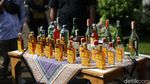 Alat Berat Gilas Barang Bukti Ribuan Botol Miras