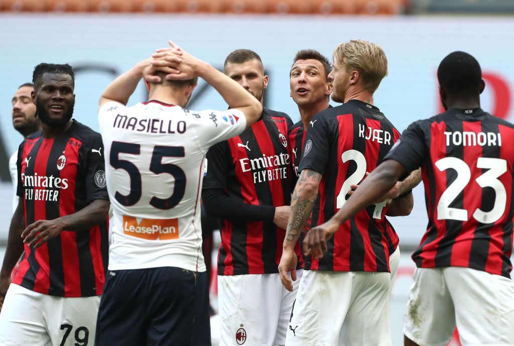 MILAN, ITALY - APRIL 18: Ante Rebic of A.C. Milan  celebrates with teammates after scoring their team's first goal  during the Serie A match between AC Milan  and Genoa CFC at Stadio Giuseppe Meazza on April 18, 2021 in Milan, Italy. Sporting stadiums around Italy remain under strict restrictions due to the Coronavirus Pandemic as Government social distancing laws prohibit fans inside venues resulting in games being played behind closed doors. (Photo by Marco Luzzani/Getty Images)
