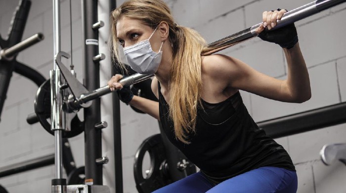 fitness Person working out at gym during pandemic