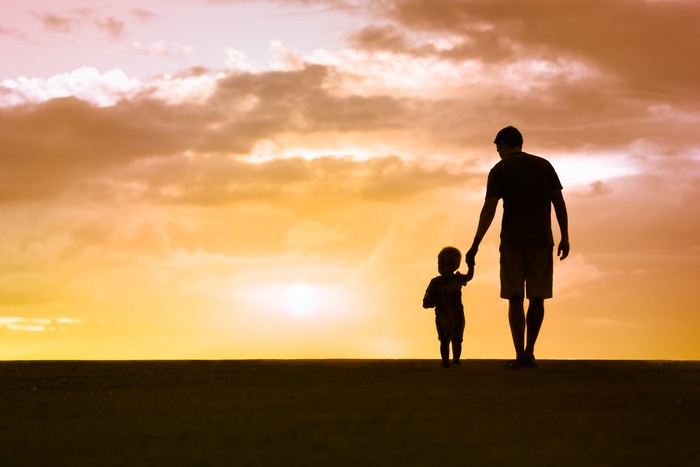 Ilustrasi ayah dan anak Loving father walking side by side with son holding hands.