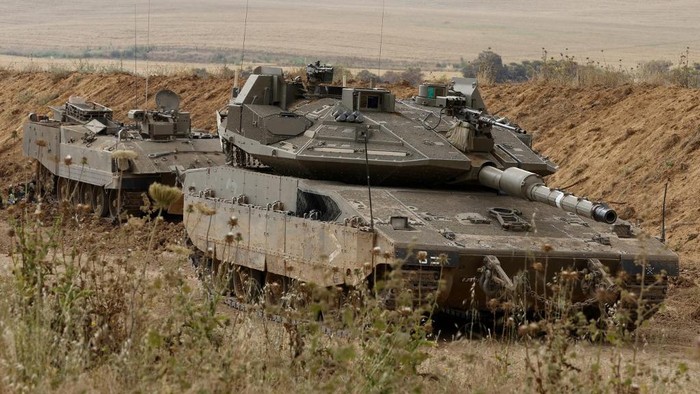 Israeli tanks are stationed along the Israel-Gaza border, on April 24, 2021. - Israeli warplanes struck the Gaza Strip early today after repeated salvos of rocket fire into Israel followed a second night of clashes between Palestinians and police in Israeli-annexed east Jerusalem.
Thirty-six rockets were launched, the Israeli army said, the most in a single night this year, after Gazas Islamist rulers Hamas voiced support for the east Jerusalem protests, which were fuelled by a Thursday march by far-right Jews. (Photo by JACK GUEZ / AFP)