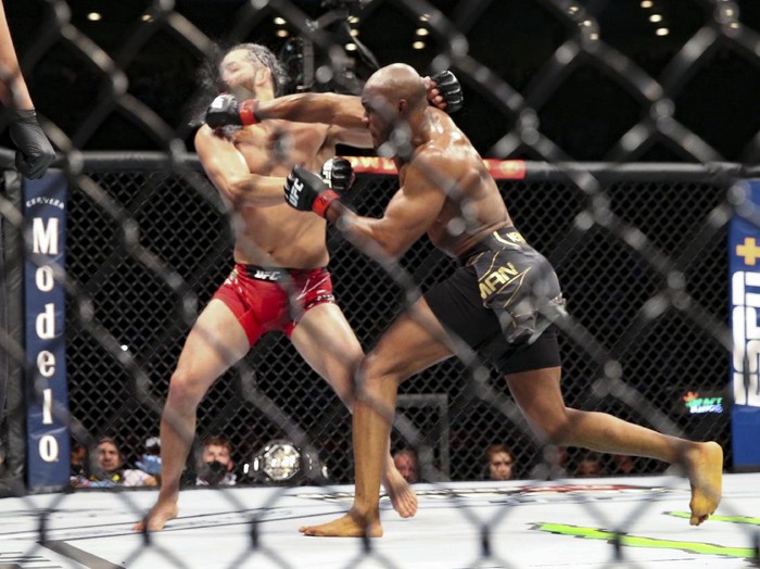 Kamaru Usman knocks out Jorge Masvidal during a UFC 261 mixed martial arts bout early Sunday, April 25, 2021, in Jacksonville, Fla.  (AP Photo/Gary McCullough)
