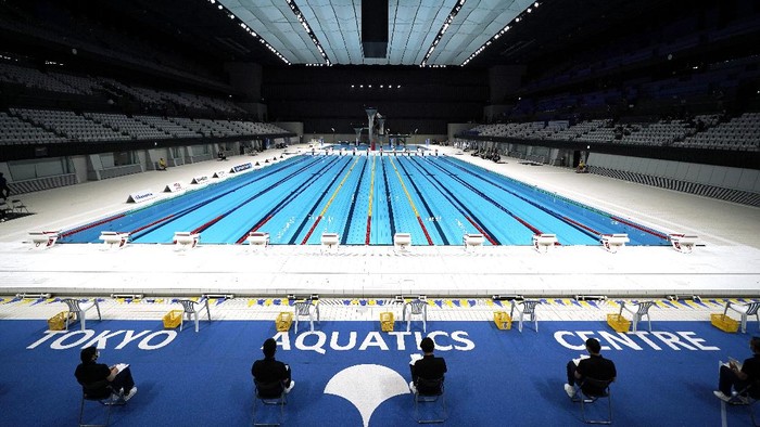 One of swimmers takes off a starting block for a demonstration during Paralympic swimming test event at the Tokyo Aquatics Center, one of the venues of Tokyo 2020 Olympic and Paralympic games, Monday, April 26, 2021, in Tokyo. (AP Photo/Eugene Hoshiko)