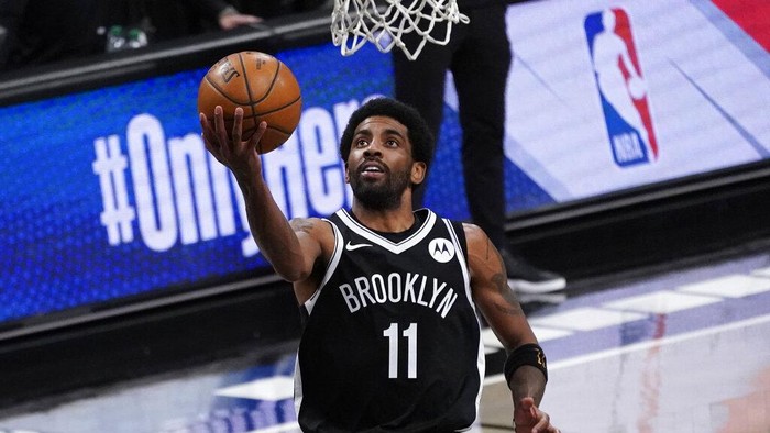 Brooklyn Nets guard Kyrie Irving goes to the basket during the second half of an NBA basketball game against the Boston Celtics, Friday, April 23, 2021, in New York. (AP Photo/Mary Altaffer)