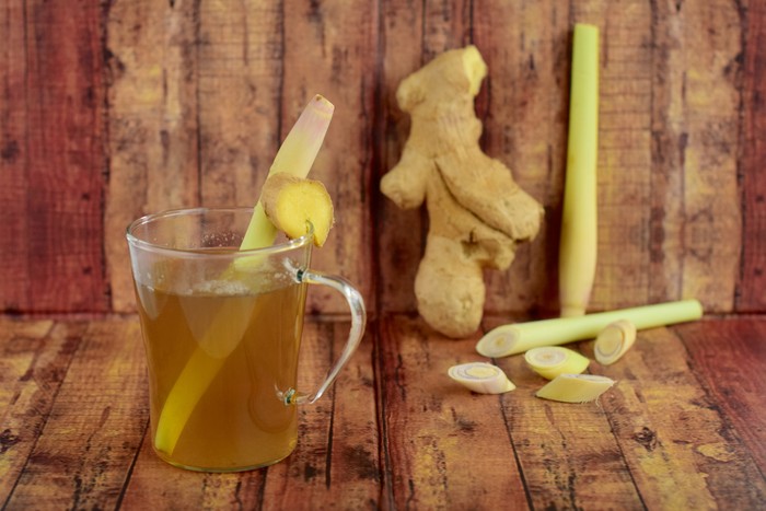 Wedang Jahe Hot ginger lemongrass tea on wooden background
