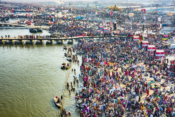 Allahabad, India - February 10, 2013: Allahabad, India - February 10, 2013:Thousands of Hindu devotees come to the confluence of the Ganges and the Yamuna River for holy dip during the festival Kumbh Mela. It is the worlds largest religious gathering