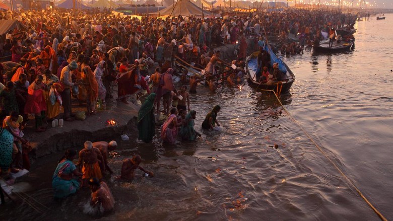 Allahabad, India - February 10, 2013: Allahabad, India - February 10, 2013:Thousands of Hindu devotees come to the confluence of the Ganges and the Yamuna River for holy dip during the festival Kumbh Mela. It is the worlds largest religious gathering
