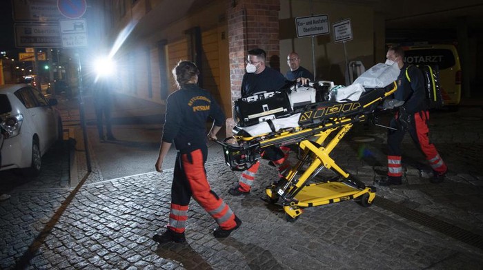 Paramedics leave the Oberlin Clinic hospital in Potsdam, Germany, Wednesday, April 28, 2021. German news agency dpa reported Wednesday that four people have been killed at the hospital in the eastern city of Potsdam and that a 51-year-old woman has been arrested. (Paul Zinken/dpa via AP)