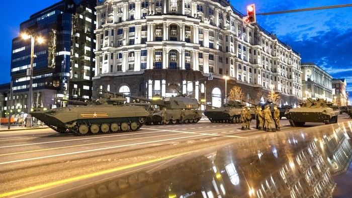 Parked Russian military vehicles preparing to roll along Tverskaya street toward Red Square during a rehearsal for the Victory Day military parade in Moscow, Russia, Thursday, April 29, 2021. The parade will take place at Moscow's Red Square on May 9 to celebrate 76 years of the victory in WWII. (AP Photo/Alexander Zemlianichenko)