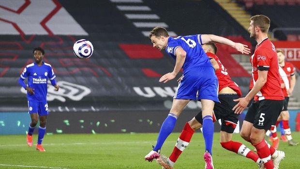 Leicester's Jonny Evans scores his side's opening goal during the English Premier League soccer match between Southampton and Leicester City at St. Mary's Stadium in Southampton, England, Friday, April 30, 2021. (Michael Steele/Pool via AP)