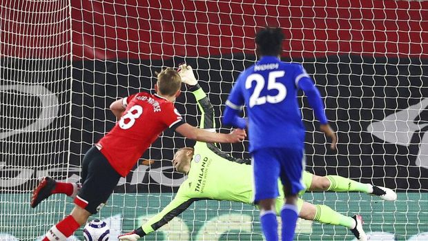 Southampton's James Ward-Prowse scores on a penalty kick during the English Premier League soccer match between Southampton and Leicester City at St. Mary's Stadium in Southampton, England, Friday, April 30, 2021. (Michael Steele/Pool via AP)