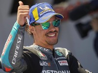 Italian rider Franco Morbidelli celebrates taking third place after the MotoGP Spanish Motorcycle Grand Prix at the Angel Nieto racetrack in Jerez de la Frontera, Spain, Sunday, May 2, 2021. (AP Photo/Jose Breton)